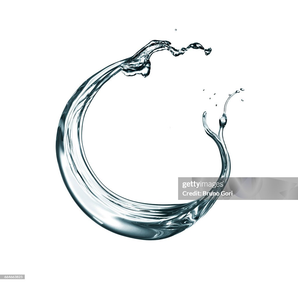 Transparent liquid swirling against white background