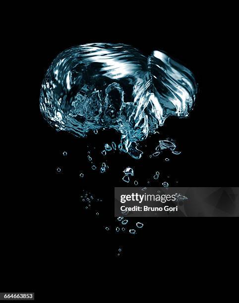 transparent liquid and bubbles rising against black background - slow motion water stock pictures, royalty-free photos & images