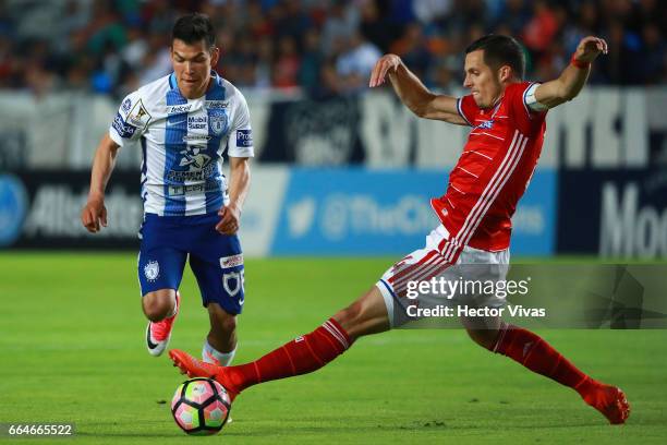 Hirving Lozano of Pachuca struggles for the ball with Matt Hedges of FC Dallas during the semifinals second leg match between Pachuca and FC Dallas...