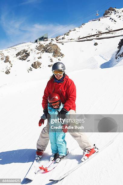 portrait of mother and son on skis - french alps skiing stock pictures, royalty-free photos & images
