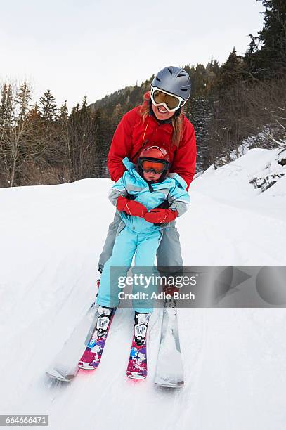portrait of mother and son on skis - french alps skiing stock pictures, royalty-free photos & images