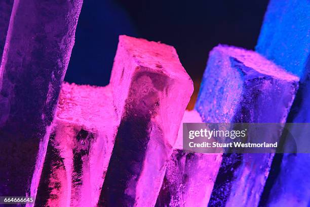 stack of ice blocks lit with colourful lights near fairbanks, alaska - isskulptur bildbanksfoton och bilder