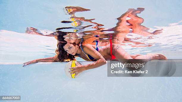 woman wearing bikini underwater in swimming pool, eyes open - both eyes open looking away bildbanksfoton och bilder
