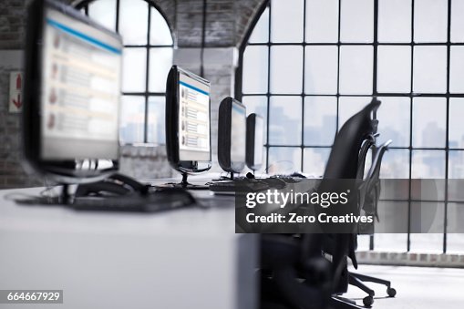 Call Center Computer Systems Row Of Desktop Computers At Call Centre Workstation High-Res Stock ...