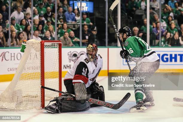 Arizona Coyotes goalie Mike Smith misses a shot by Dallas Stars center Jason Dickinson for a goal during the game between the Dallas Stars and the...