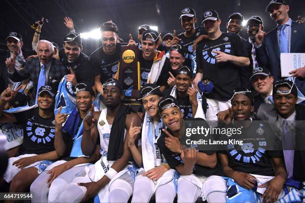 Players and coaches of the North Carolina Tar Heels celebrate following their 71-65 victory against the Gonzaga Bulldogs during the 2017 NCAA Men's...