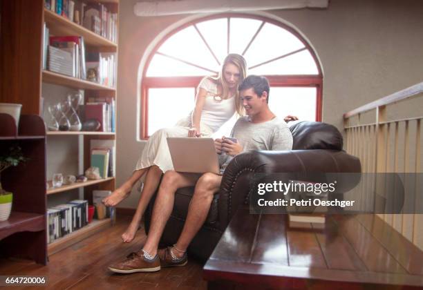a young couple studying together. - hourglass books fotografías e imágenes de stock