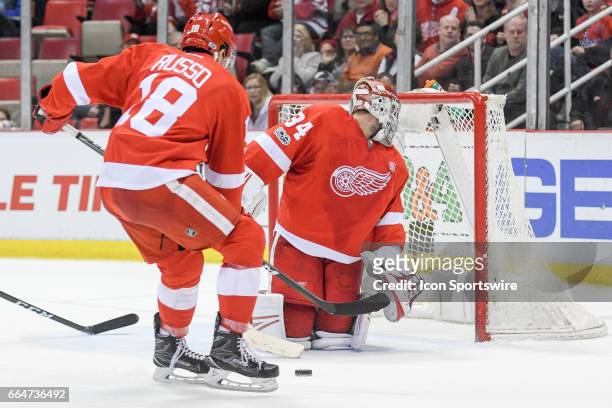 Detroit Red Wings goalie Petr Mrazek stops this low shot from Ottawa Senators left wing Mike Hoffman during the overtime period in the NHL hockey...