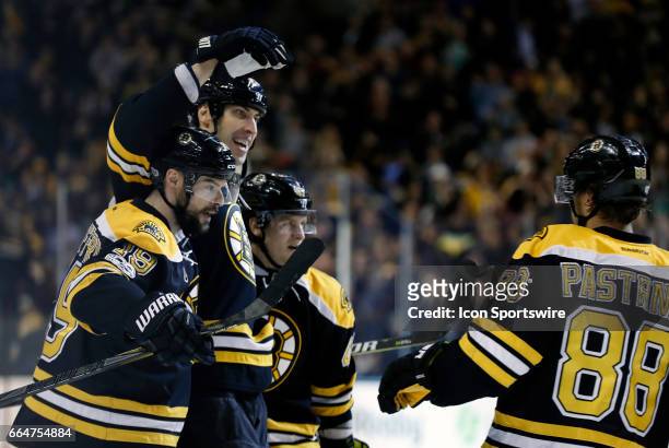 Boston Bruins left defenseman Zdeno Chara celebrates his goal with Boston Bruins right wing Drew Stafford , Boston Bruins left defenseman Torey Krug...