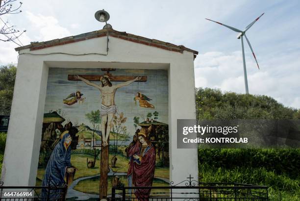 Votive chapel in the Montelongo wind farm in Molise, southern Italy. One of the biggest wind farms of southern Italy for the production of...