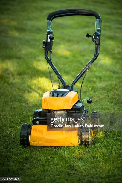 lawn mower on grass - grasmaaier stockfoto's en -beelden