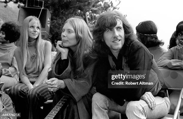 Graham Nash and Joni Mitchell wait before performing at the Big Sur Folk Festival at the Esalen Institue on September 14-15, 1969 in Big Sur,...