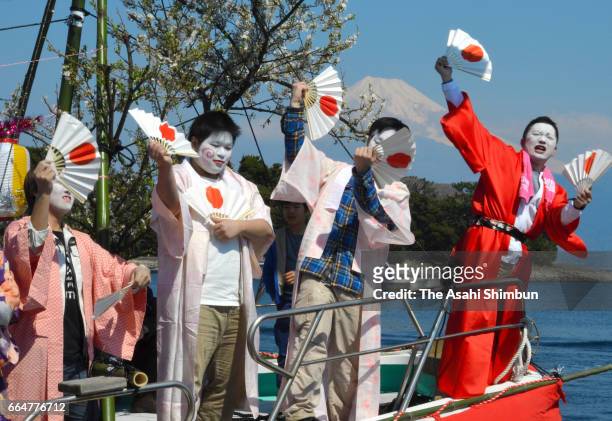 Fishermen and boys dressed and make-up as women dance on a decorated boat during annual Ose Festival at Suruga Bay on April 4, 2017 in Numazu,...