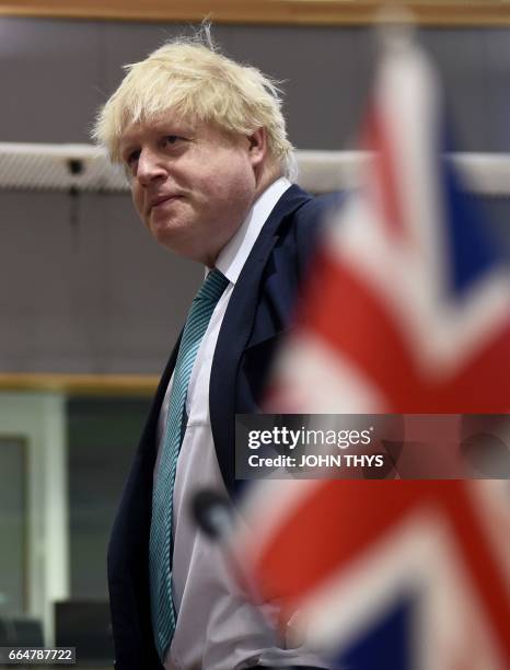 British Foreign Secretary Boris Johnson looks on during a conference on Syria and the region at the Europa Building in Brussels on April 5, 2016. -...