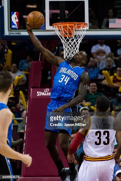 Jeff Green of the Orlando Magic dunks over Jonathan Holmes of the Cleveland Cavaliers during the second half of a preseason game at Quicken Loans...