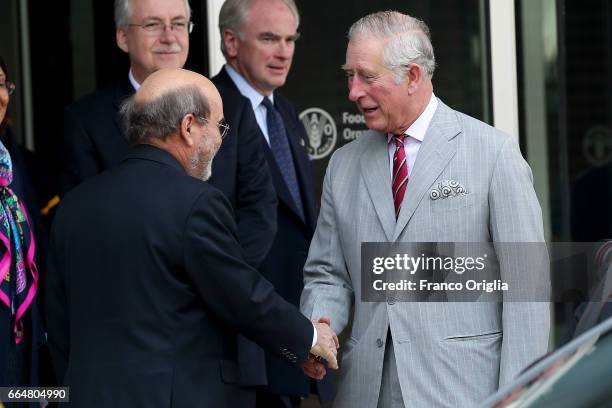 Prince Charles Prince of Wales greets FAO Director General Jose Graziano da Silva at the end of the visit to the Food and Agriculture Organization...