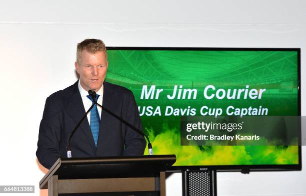 Jim Courier of the USA speaks at the official dinner at GOMA ahead of the Davis Cup World Group Quarterfinal match between Australia and the USA on...
