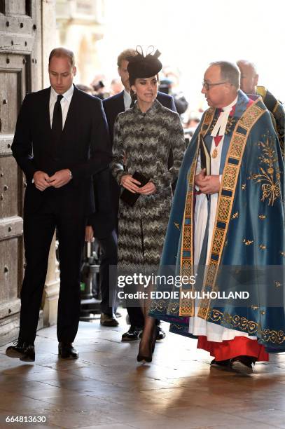 Britain's Prince William, Duke of Cambridge, , Britain's Catherine, Duchess of Cambridge, and John Hall, Dean of Westminster arrive at a Service of...