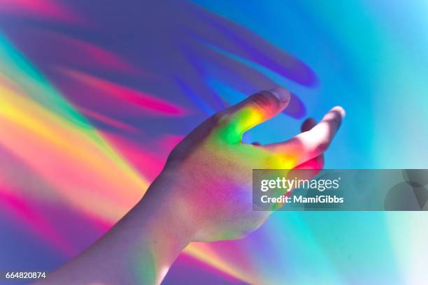 hologram paper art of reflection - multi coloured hands stock pictures, royalty-free photos & images