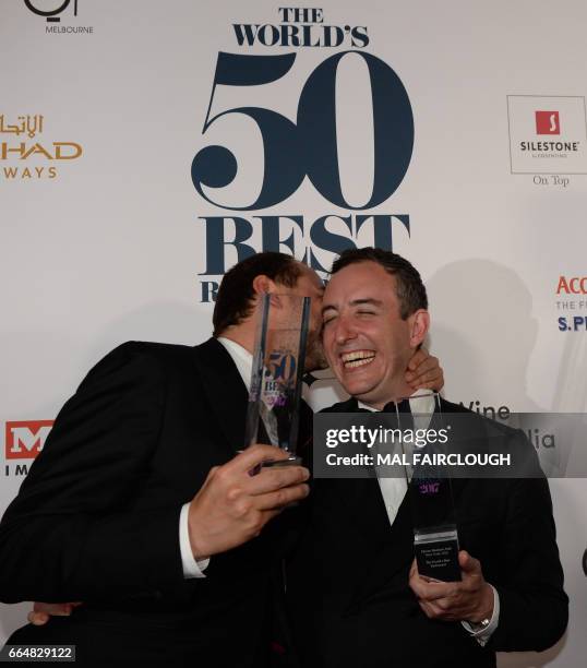 Daniel Humm and Will Guidara celebrate with their trophies after winning the Worlds Best Restaurant award at the World's 50 Best Restaurants awards...