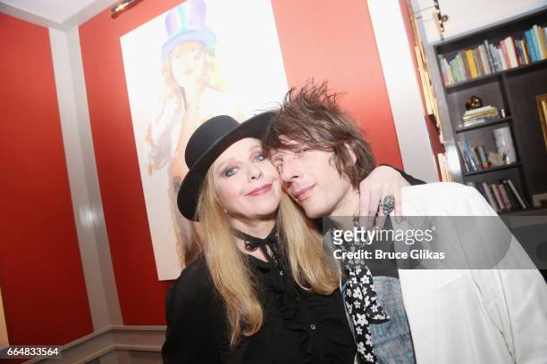 Bebe Buell and her husband Jimmy Walls pose as Buell visits the HGU New York's 1905 Lounge at the HGU New York Hotel on April 4, 2017 in New York...