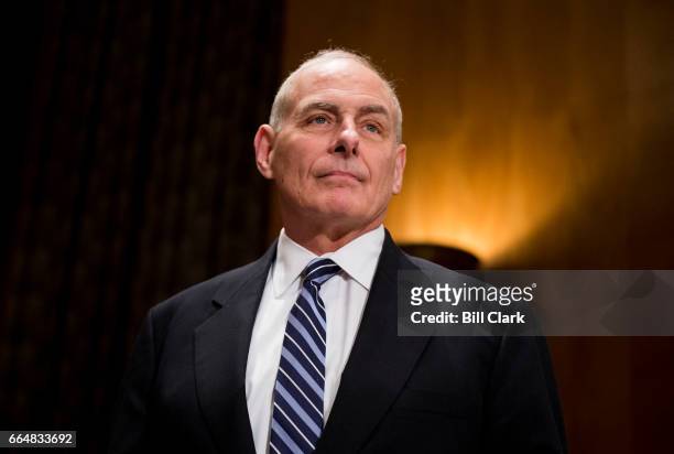 Secretary of Homeland Security John Kelly prepares to testify during the Senate Homeland Security and Governmental Affairs Committee hearing on...
