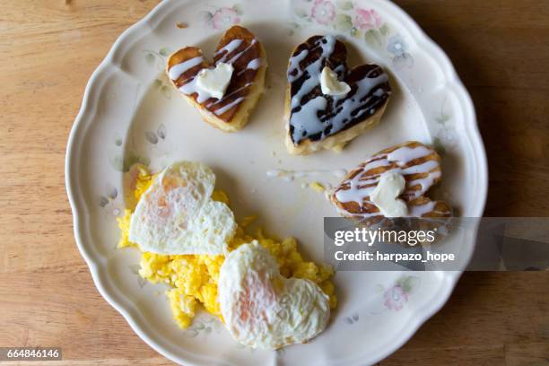 heart-shaped pancakes and eggs. - amateur photography stock pictures, royalty-free photos & images