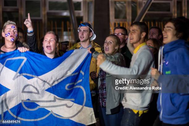 Edinburgh, Scotland . Supporter of YES campaign gathered in front of the Scottish Parliament Building the night before to receive the final results...