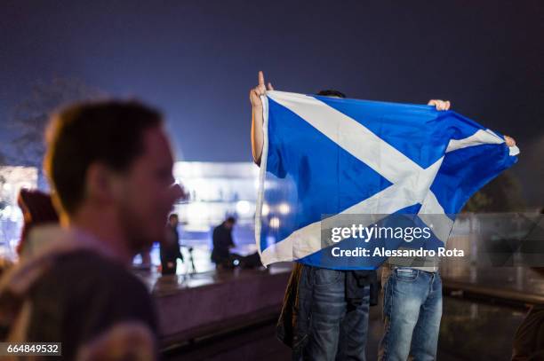 Edinburgh, Scotland . Supporter of YES campaign gathered in front of the Scottish Parliament Building the night before to receive the final results...