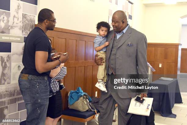 Hall of Famer and former Georgetown Hoyas player Patrick Ewing with son Patrick Jr. And grandson Trey visit before being introduced as the Georgetown...