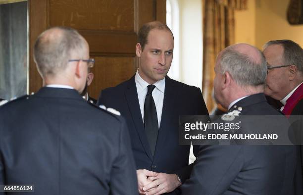 Britain's Prince William, Duke of Cambridge chats to members of the congregation after a Service of Remembrance at Westminster Abbey in central...