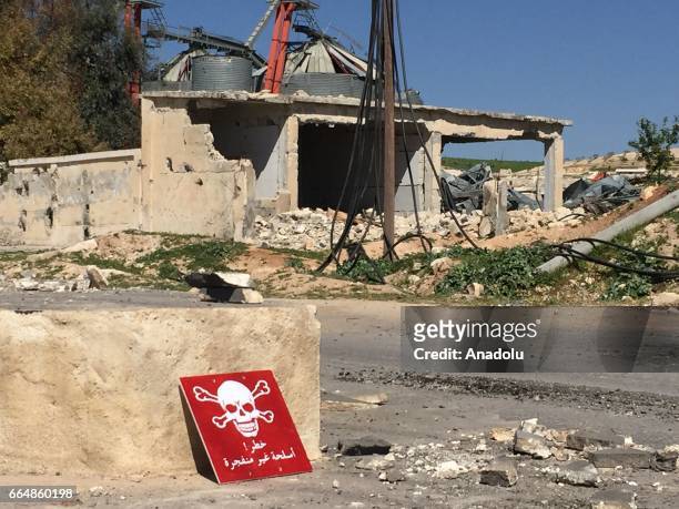 Poison hazard danger sign is seen in the town of Khan Shaykun, Idlib province, Syria on April 05, 2017. On Tuesday more than 100 civilians had been...