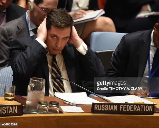 Russia's deputy UN ambassador, Vladimir Safronkov attends the United Nations Security Council meet in an emergency session at the UN on April 5, 2017...