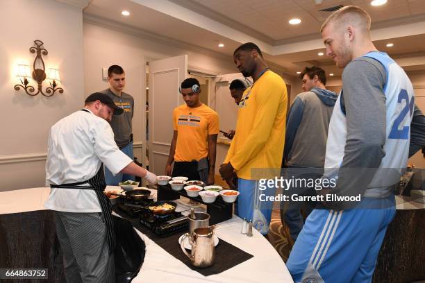 Nikola Jokic, Gary Harris, Roy Hibbert and Mason Plumlee of the Denver Nuggets eat at the hotel before practice on April 4, 2017 at the Smoothie King...