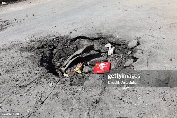 Poison hazard danger sign is seen in the town of Khan Shaykun, Idlib province, Syria on April 05, 2017. On Tuesday more than 100 civilians had been...