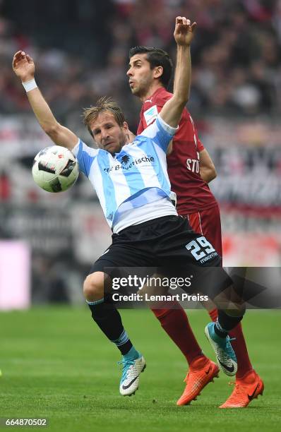 Stefan Aigner of TSV 1860 Muenchen challenges Emiliano Insua of VfB Stuttgart during the Second Bundesliga match between TSV 1860 Muenchen and VfB...