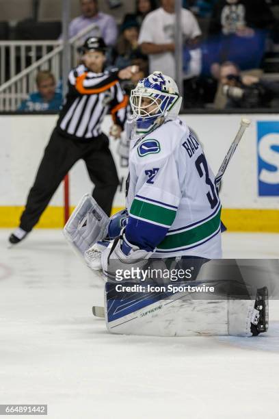 Vancouver Canucks goalie Richard Bachman looks frustrated as the referee signals a San Jose goal during the third period of the regular season game...