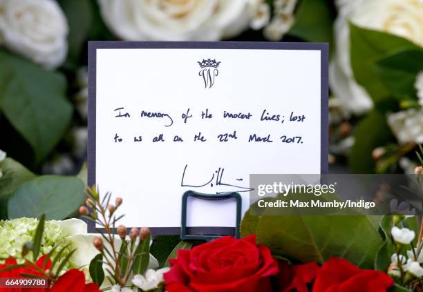 Prince William, Duke of Cambridge's hand written message seen on a wreath which he laid before attending a Service of Hope at Westminster Abbey on...