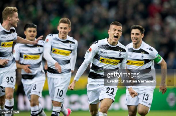 Laszlo Benes of Borussia Moenchengladbach celebrate with his teammates after he scores his teams first goal during the Bundesliga Match between...