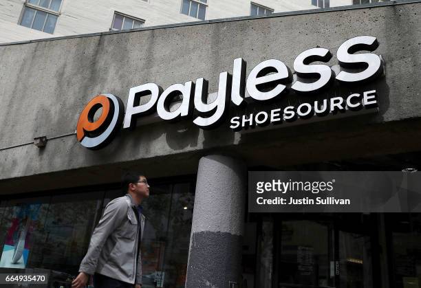 Pedestrian walks by a Payless Shoe Source store on April 5, 2017 in San Francisco, California. Kansas-based discount shoe retailer Payless Shoe...