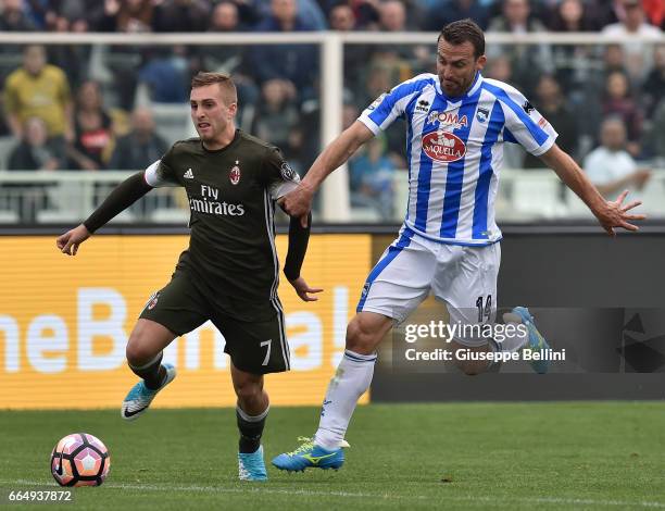 Gerard Deulofeu of AC Milan and Hugo Campagnaro of Pescara Calcio in action during the Serie A match between Pescara Calcio and AC Milan at Adriatico...