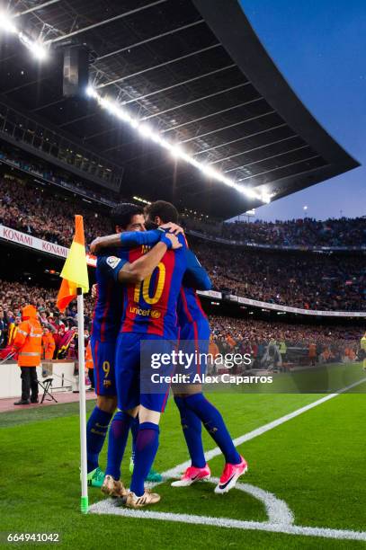 Lionel Messi of FC Barcelona celebrates with his teammates Luis Suarez and Neymar Santos Jr after scoring his team's second goal during the La Liga...