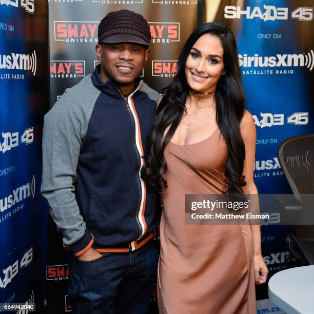 Host Sway Calloway and WWE professional wrestler Nikki Bella pose together for a photo during 'Sway in the Morning' on Eminem's exclusive SiriusXM...