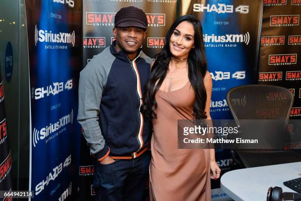 Host Sway Calloway and WWE professional wrestler Nikki Bella pose together for a photo during 'Sway in the Morning' on Eminem's exclusive SiriusXM...