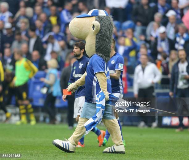 Referee, Felix Zwayer is shown a red card by the Schalke mascot, Erwin after the Bundesliga match between FC Schalke 04 and Borussia Dortmund at...