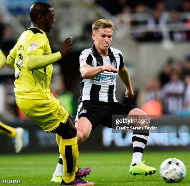 Matt Ritchie of Newcastle United to close down Marvin Sordell of Burton Albion during the Sky Bet Championship Match between Newcastle United and...