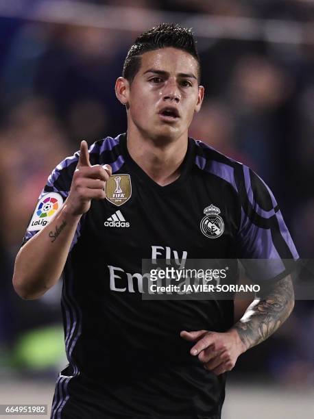 Real Madrid's Colombian midfielder James Rodriguez celebrates after scoring during the Spanish league football match Club Deportivo Leganes SAD vs...
