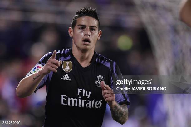 Real Madrid's Colombian midfielder James Rodriguez celebrates after scoring during the Spanish league football match Club Deportivo Leganes SAD vs...