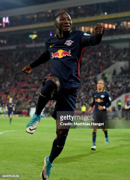 Naby Deco Keita of Leipzig celebrates after he scores his team's 3rd goal during the Bundesliga match between 1. FSV Mainz 05 and RB Leipzig at Opel...