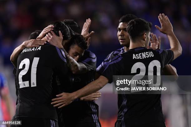 Real Madrid players celebrate after scoring their third goal during the Spanish league football match Club Deportivo Leganes SAD vs Real Madrid CF at...